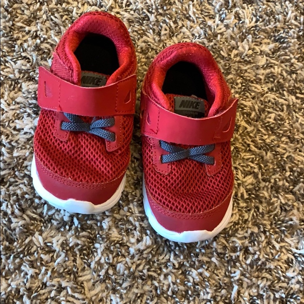 Red Nike tennis shoes